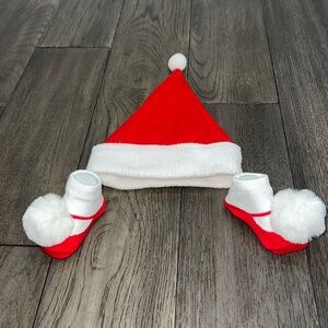 NWOT infant Santa hat with matching sock booties with pom-poms